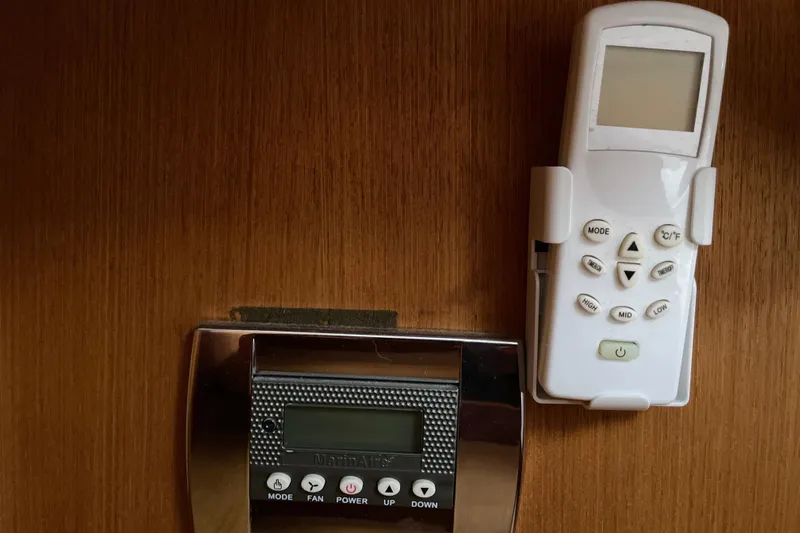  Yacht Photos Pics Control panel and remote on wood panel, Hunter Passage 420, 1999 model.