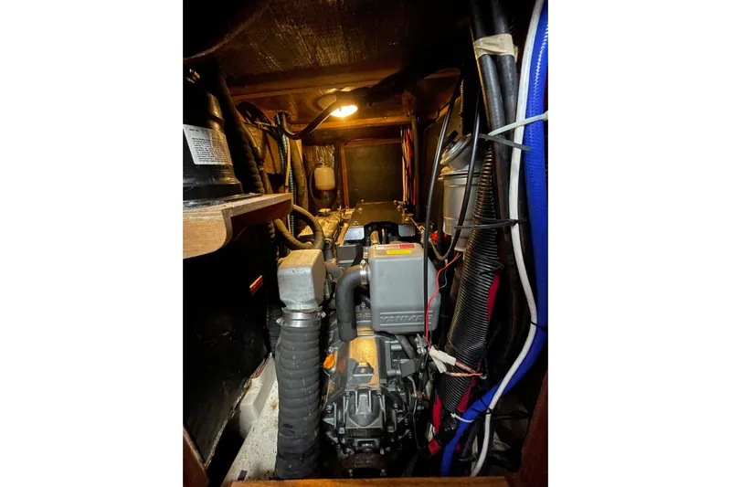  Yacht Photos Pics Engine room of 1999 Hunter Passage 420 sailboat with visible wiring and components.