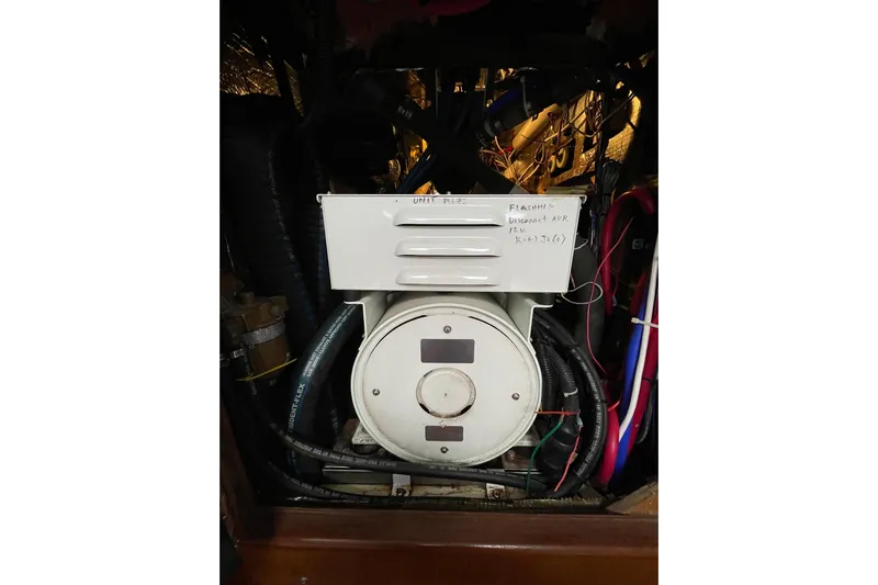  Yacht Photos Pics Engine compartment of a 1999 Hunter Passage 420 sailboat, showing mechanical components and wiring.