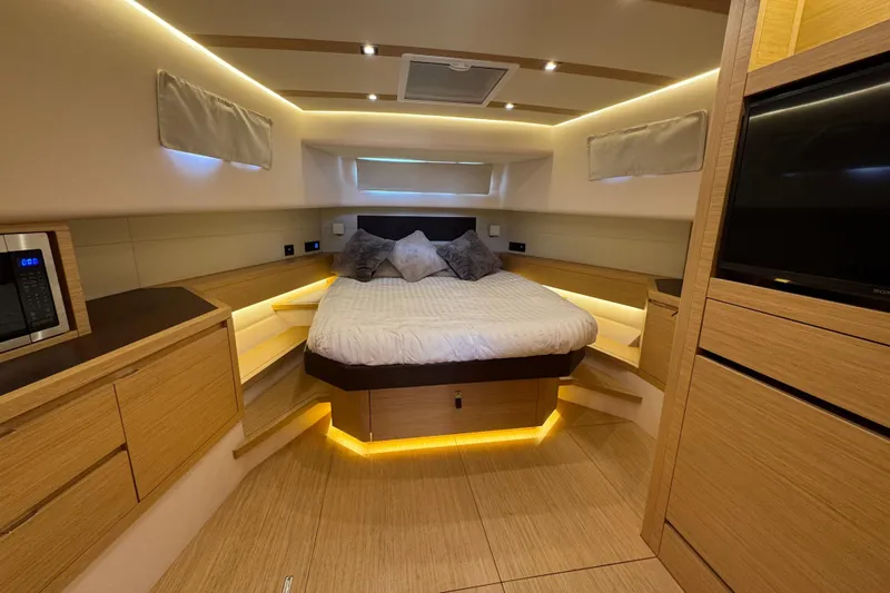  Yacht Photos Pics Luxurious interior of 2020 Pardo Yachts 50 with modern wood finish and ambient lighting.