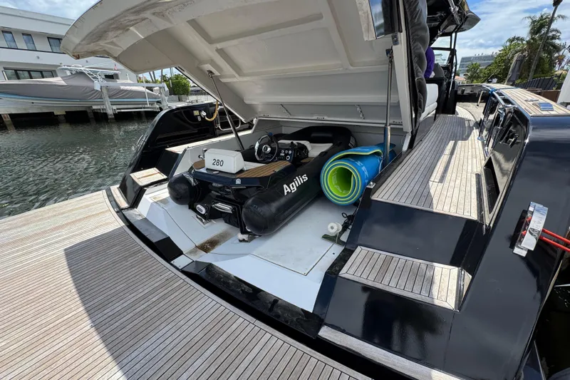  Yacht Photos Pics 2020 Pardo Yachts 50 with open storage, docked, featuring water sports equipment.