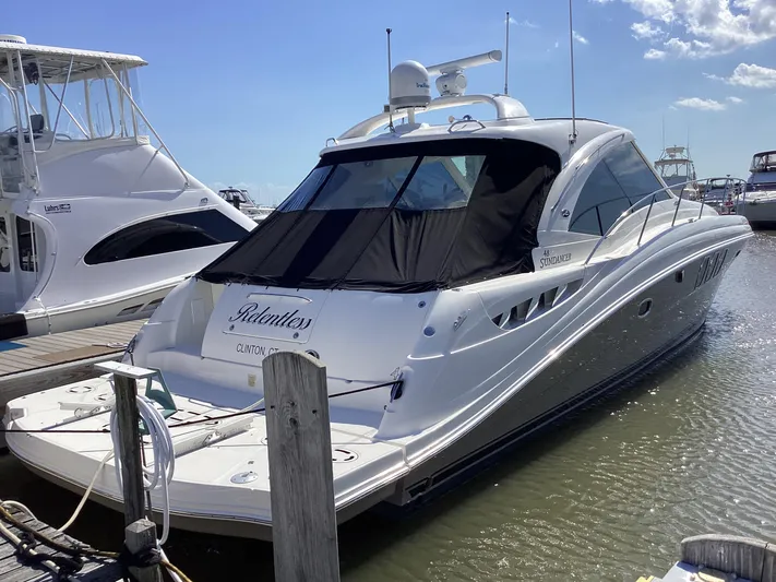  Yacht Photos Pics 2006 Sea Ray 48 Sundancer yacht docked at marina under clear blue sky.