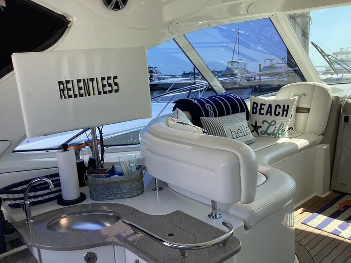  Yacht Photos Pics Interior of 2006 Sea Ray 48 Sundancer yacht with plush seating and nautical decor.