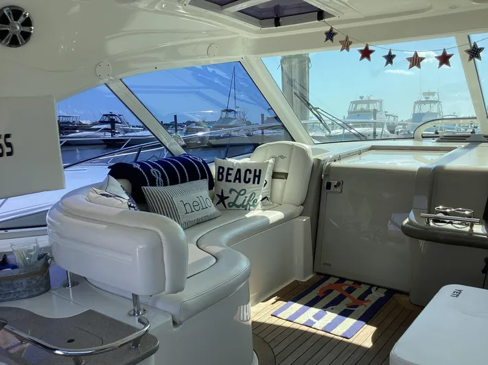  Yacht Photos Pics Interior of 2006 Sea Ray 48 Sundancer yacht with nautical decor and marina view.