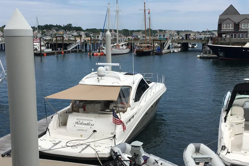  Yacht Photos Pics 2006 Sea Ray 48 Sundancer yacht docked at a marina with scenic waterfront views.