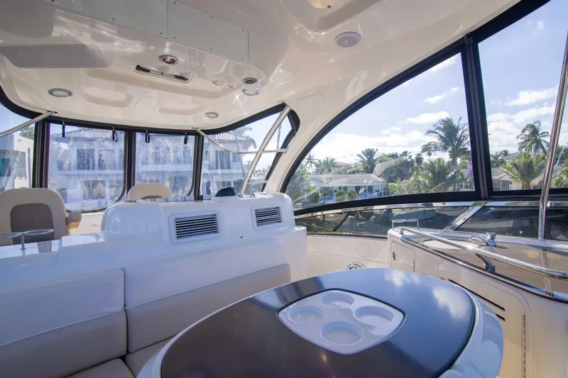 Exodus Yacht Photos Pics Luxurious interior of 2013 Sea Ray 520 Sedan Bridge yacht with panoramic windows.
