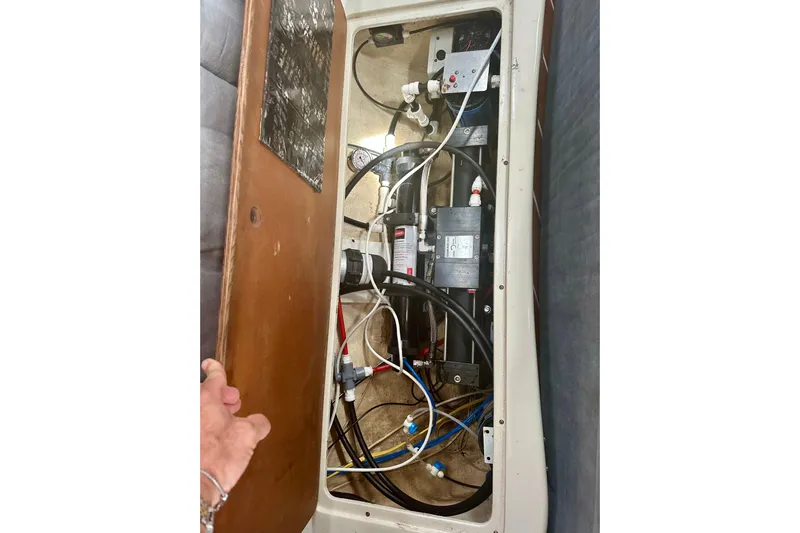 Makai Yacht Photos Pics Interior view of a 1999 Catalina 320 sailboat's electrical and plumbing system.