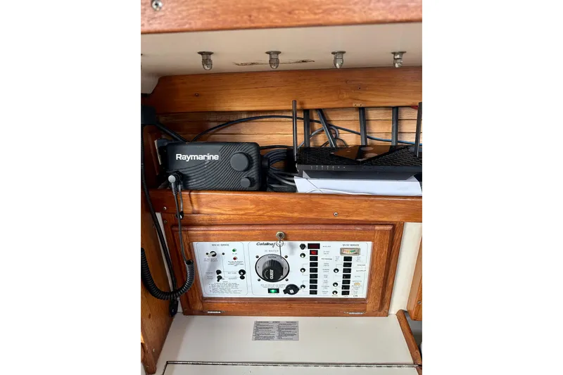 Makai Yacht Photos Pics Control panel of a 1999 Catalina 320 sailboat with Raymarine equipment.