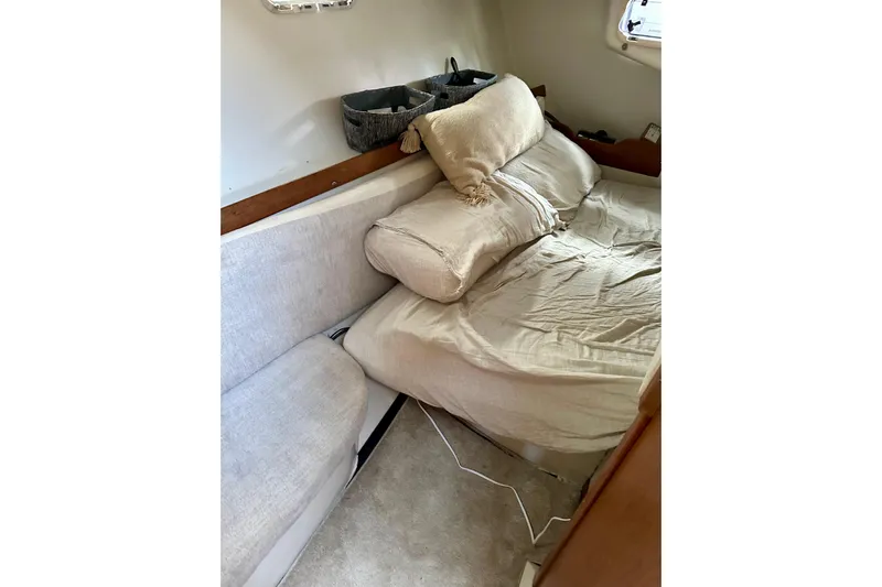 Makai Yacht Photos Pics Cozy interior cabin of 1999 Catalina 320 sailboat with comfortable bedding.