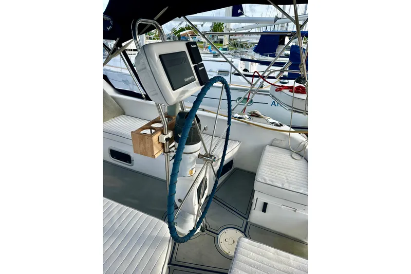 Makai Yacht Photos Pics Cockpit of 1999 Catalina 320 sailboat with steering wheel and navigation equipment.