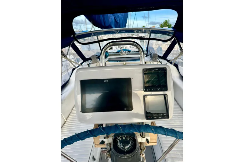 Makai Yacht Photos Pics Cockpit view of 1999 Catalina 320 sailboat with navigation instruments and compass.