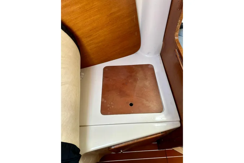 Makai Yacht Photos Pics Interior detail of a 1999 Catalina 320 sailboat, featuring wooden and white surfaces.