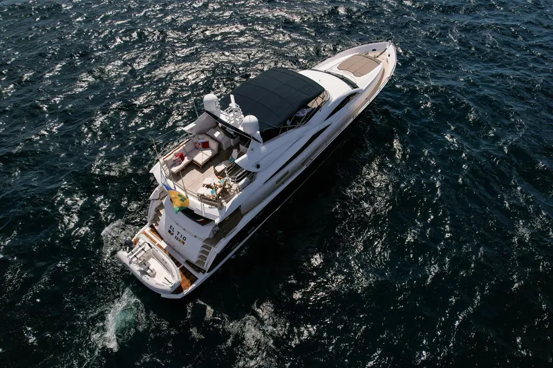 El Tio Yacht Photos Pics Sunseeker 90 Yacht 2006 cruising on open water, aerial view.