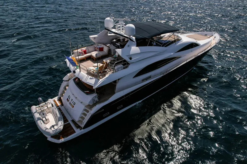 El Tio Yacht Photos Pics Luxurious 2006 Sunseeker 90 Yacht cruising on open sea, aerial view.