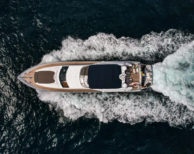 El Tio Yacht Photos Pics Aerial view of 2006 Sunseeker 90 Yacht cruising on open water.