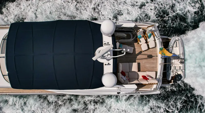 El Tio Yacht Photos Pics Sunseeker 90 Yacht 2006 cruising, aerial view, with deck seating and sunshade.