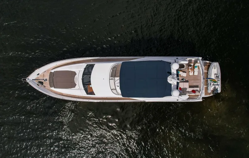 El Tio Yacht Photos Pics Aerial view of a 2006 Sunseeker 90 Yacht on dark water.