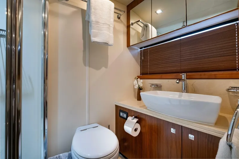 El Tio Yacht Photos Pics Luxurious bathroom in a 2006 Sunseeker 90 Yacht, featuring modern fixtures and elegant design.