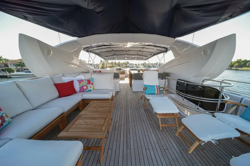 El Tio Yacht Photos Pics Luxurious 2006 Sunseeker 90 Yacht deck with comfortable seating and scenic water views.