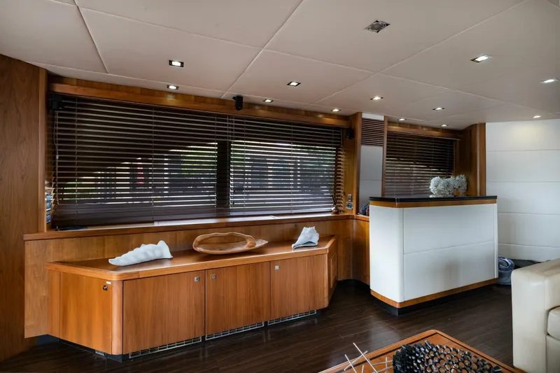 El Tio Yacht Photos Pics Luxurious interior of 2006 Sunseeker 90 Yacht with elegant wood finishes and modern decor.