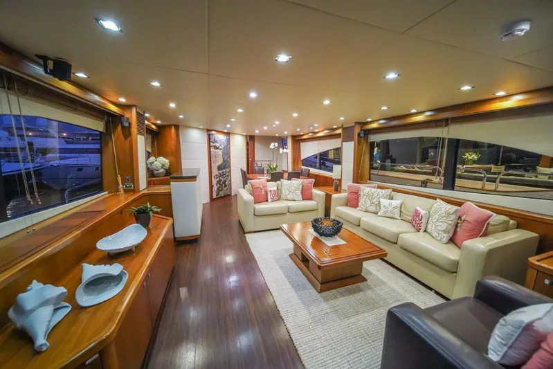 El Tio Yacht Photos Pics Luxurious interior of a 2006 Sunseeker 90 Yacht with elegant seating and wooden accents.
