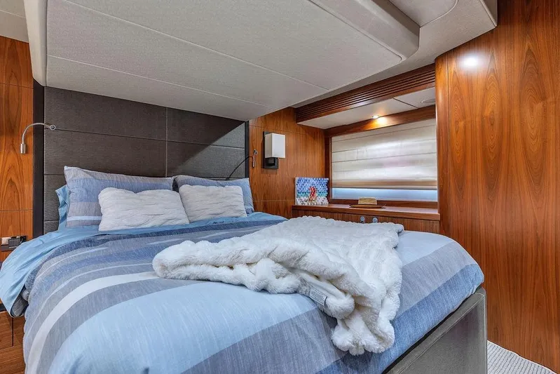 Ohana Forever Yacht Photos Pics Luxurious bedroom interior of 2016 Sunseeker Manhattan 55 yacht with cozy bedding.