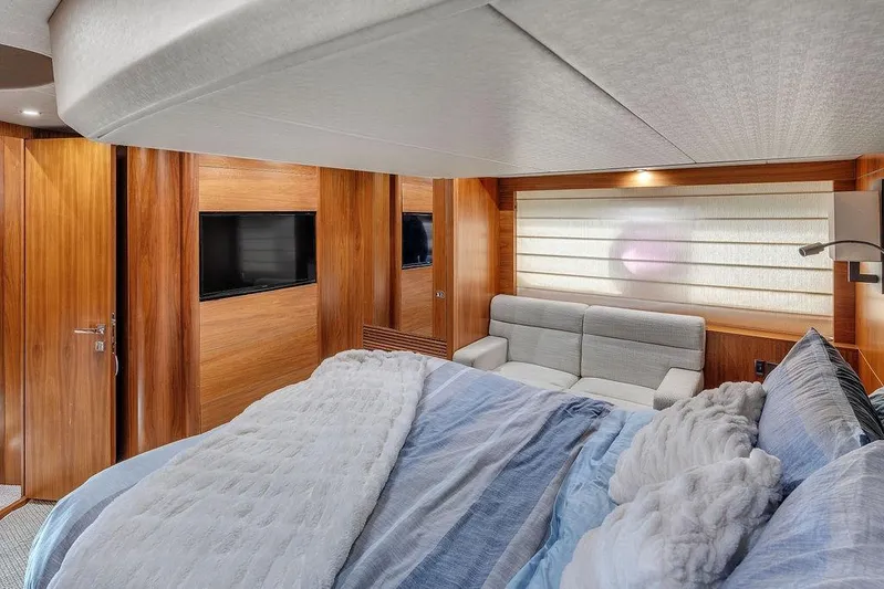 Ohana Forever Yacht Photos Pics Luxurious interior of 2016 Sunseeker Manhattan 55 yacht with cozy bed and modern decor.