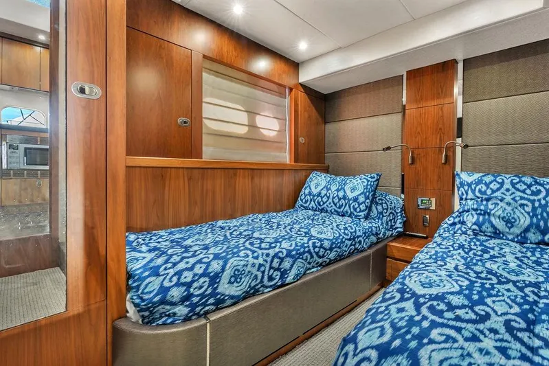 Ohana Forever Yacht Photos Pics Luxurious 2016 Sunseeker Manhattan 55 yacht cabin with twin beds and elegant wood paneling.