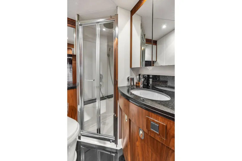 Ohana Forever Yacht Photos Pics Luxurious bathroom in 2016 Sunseeker Manhattan 55 yacht with sleek shower and elegant vanity.