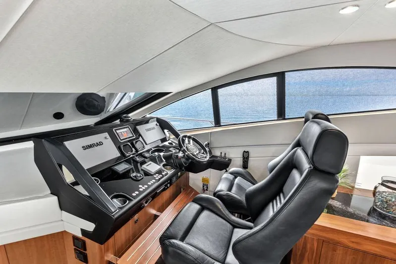 Ohana Forever Yacht Photos Pics Luxurious helm of 2016 Sunseeker Manhattan 55 yacht with Simrad navigation system.