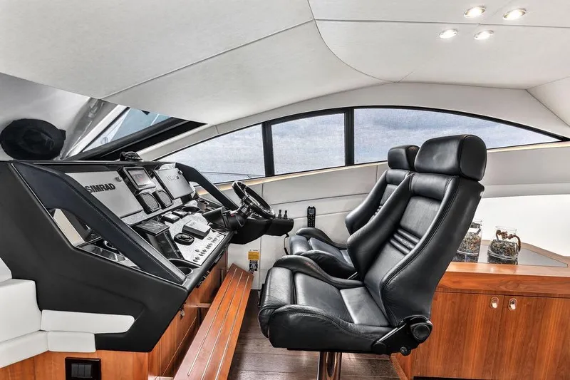 Ohana Forever Yacht Photos Pics Luxurious interior of 2016 Sunseeker Manhattan 55 yacht with leather seating and advanced controls.