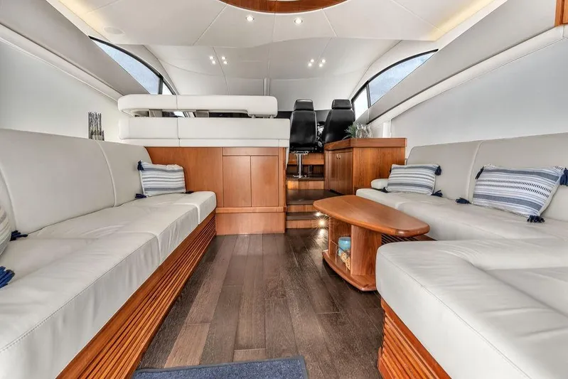 Ohana Forever Yacht Photos Pics Large salon with plenty of storage. Hidden Flatscreen tv rises &nbsp;behind starboard sofa