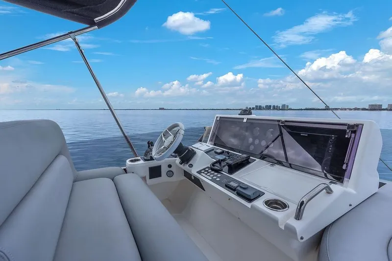 Ohana Forever Yacht Photos Pics 2016 Sunseeker Manhattan 55 yacht helm with ocean view and clear blue sky.