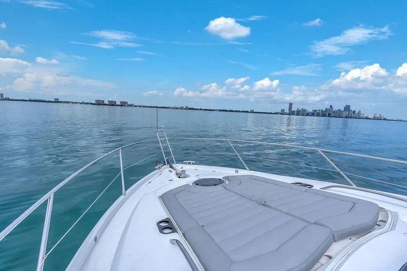 Ohana Forever Yacht Photos Pics Sunseeker Manhattan 55 yacht cruising with city skyline in the background, 2016 model.