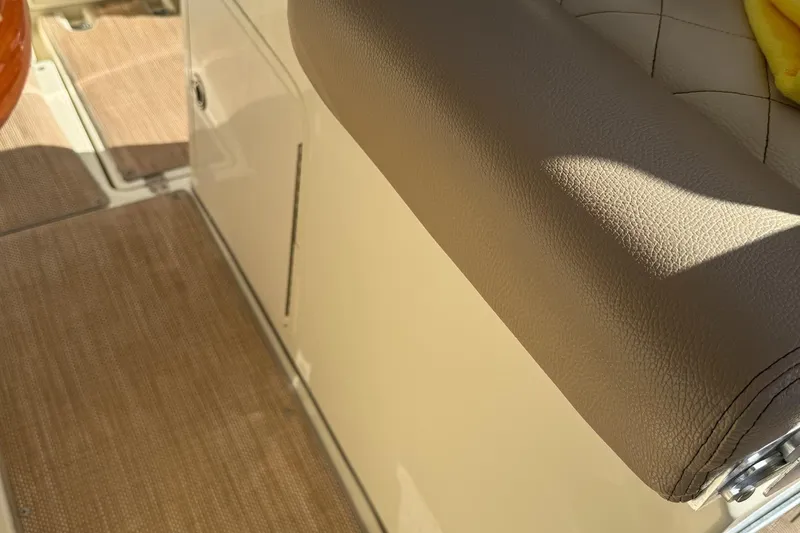  Yacht Photos Pics 2019 Chris-Craft Catalina 30 interior with beige upholstery and flooring detail.