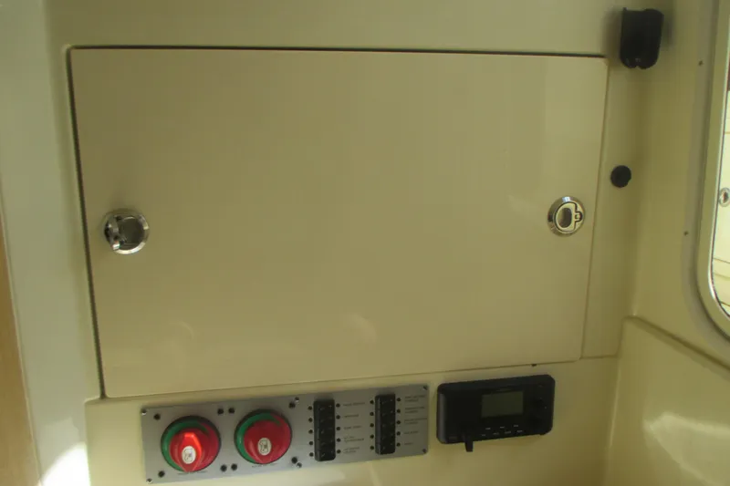  Yacht Photos Pics Control panel of 2019 Chris-Craft Catalina 30 boat, featuring switches and dials.