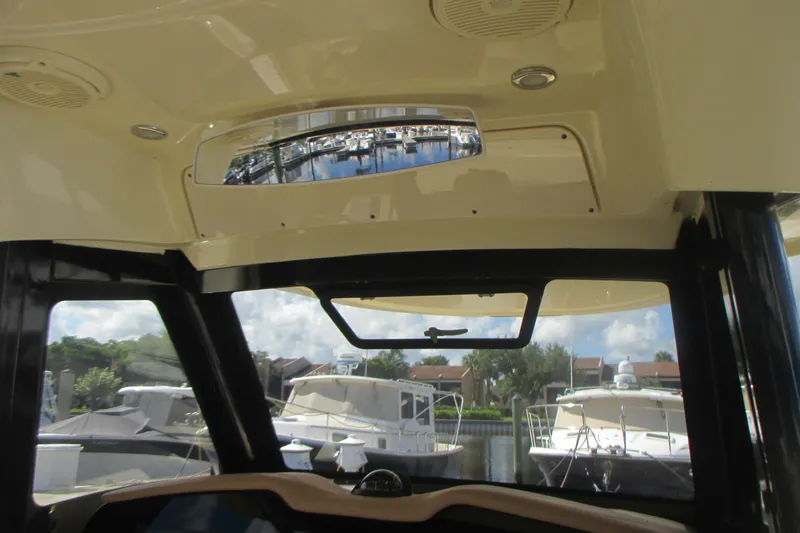  Yacht Photos Pics Interior view of 2019 Chris-Craft Catalina 30 boat with marina in background.