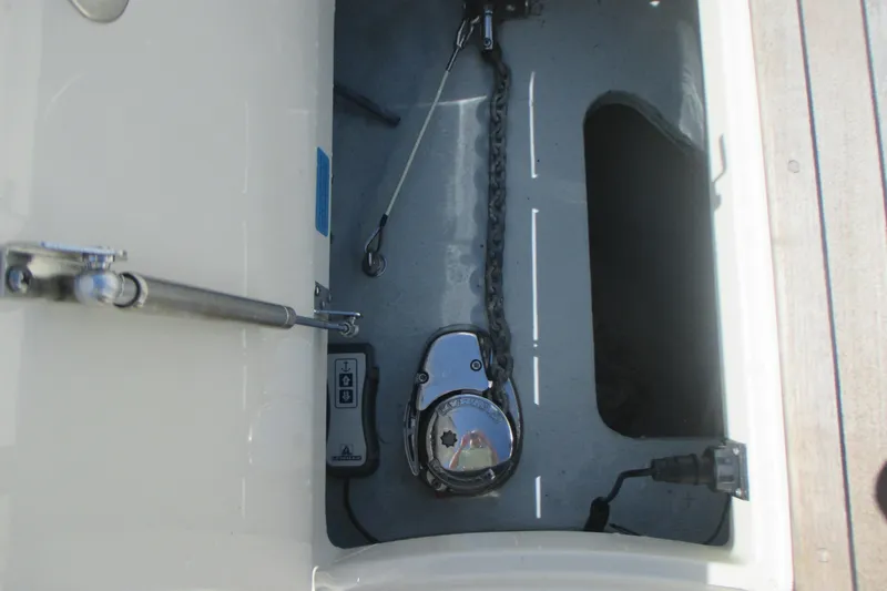  Yacht Photos Pics Anchor compartment of 2019 Chris-Craft Catalina 30 boat, featuring chain and winch.