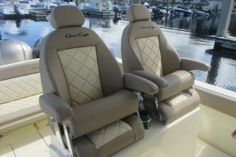  Yacht Photos Pics 2019 Chris-Craft Catalina 30 boat seats with quilted leather design at a marina.