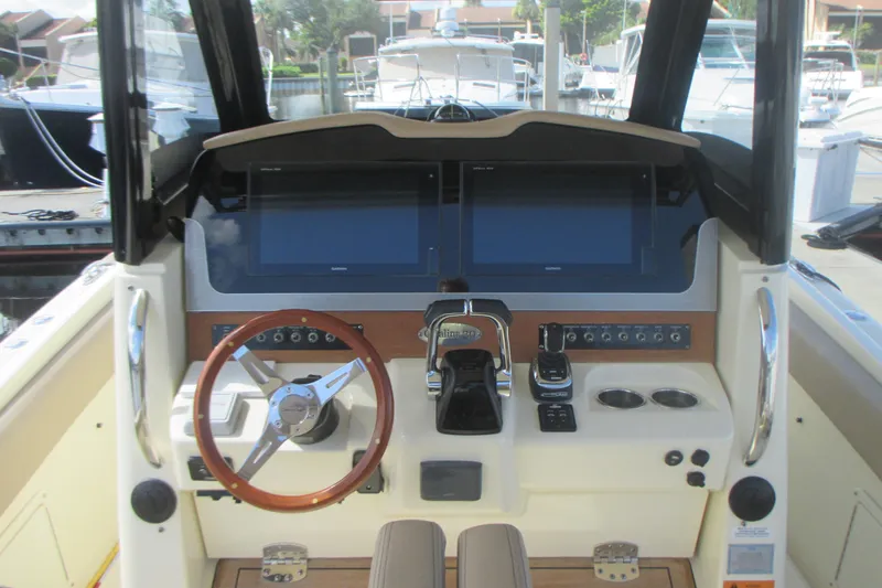  Yacht Photos Pics 2019 Chris-Craft Catalina 30 helm with dual screens and wooden steering wheel.