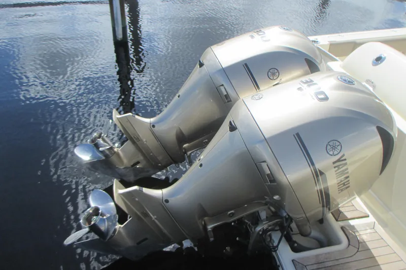  Yacht Photos Pics Twin Yamaha outboard engines on a 2019 Chris-Craft Catalina 30 boat, docked on water.