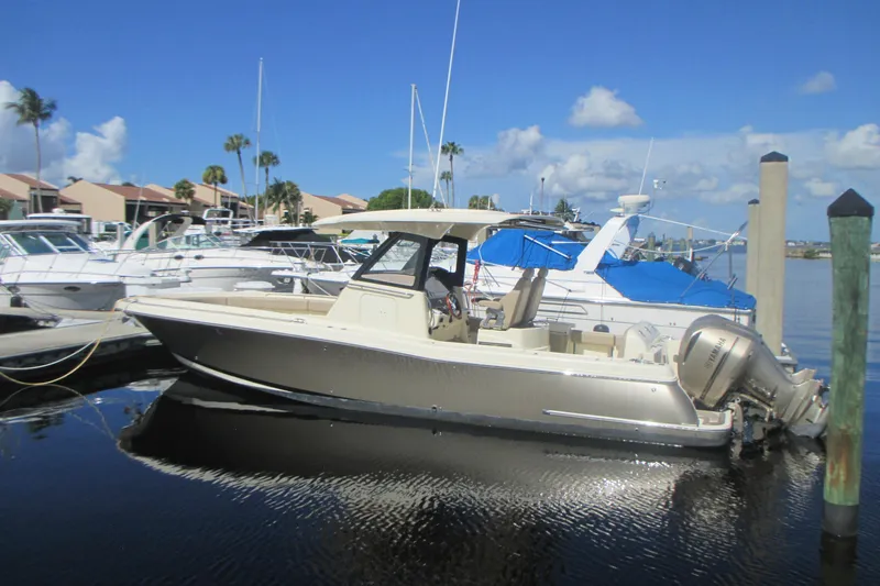  Yacht Photos Pics 2019 Chris-Craft Catalina 30 boat docked at marina under clear blue sky.