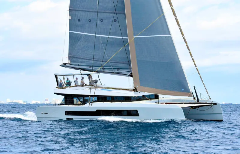Noble House Yacht Photos Pics 2019 McConaghy MC60 yacht sailing on open sea with crew onboard.