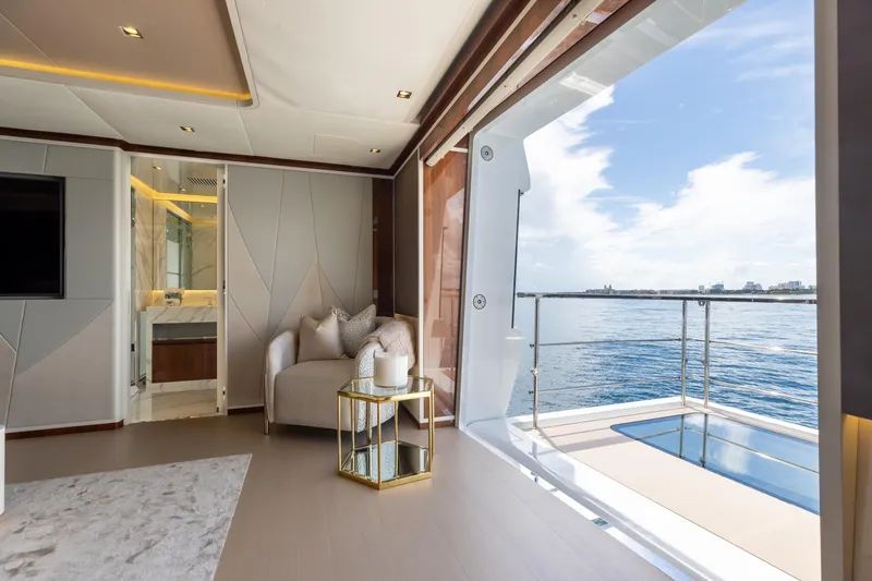 Goldeneye Yacht Photos Pics Luxurious interior of 2020 Mangusta 54 Gransport yacht with ocean view and elegant decor.