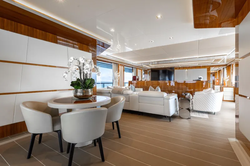 Goldeneye Yacht Photos Pics Luxurious interior of 2020 Mangusta 54 Gransport yacht with elegant seating and modern decor.
