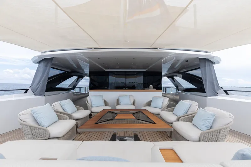 Goldeneye Yacht Photos Pics Luxurious 2020 Mangusta 54 Gransport yacht deck with elegant seating and ocean view.