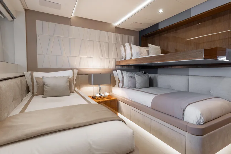 Goldeneye Yacht Photos Pics Luxurious bedroom interior of 2020 Mangusta 54 Gransport yacht with modern design and elegant decor.