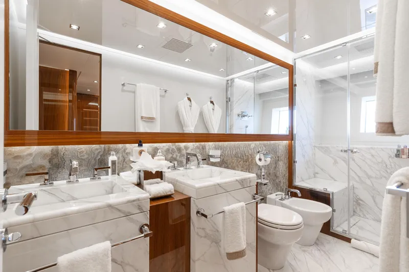 Goldeneye Yacht Photos Pics Luxurious bathroom in 2020 Mangusta 54 Gransport yacht with marble finishes and modern fixtures.