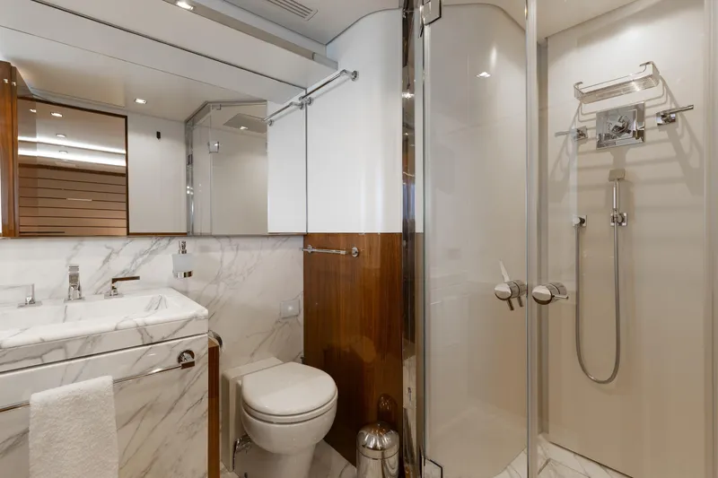 Goldeneye Yacht Photos Pics Luxurious bathroom in 2020 Mangusta 54 Gransport yacht with marble and wood accents.