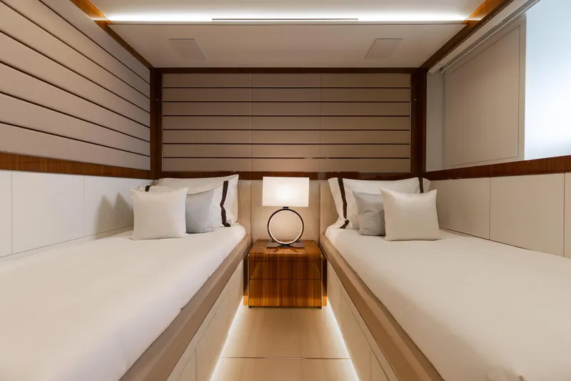 Goldeneye Yacht Photos Pics Luxurious twin cabin interior of 2020 Mangusta 54 Gransport yacht with modern decor.
